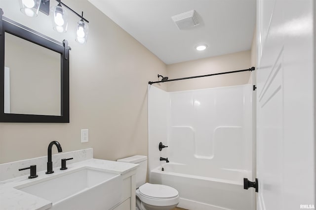 bathroom with shower / bathing tub combination, visible vents, toilet, and vanity