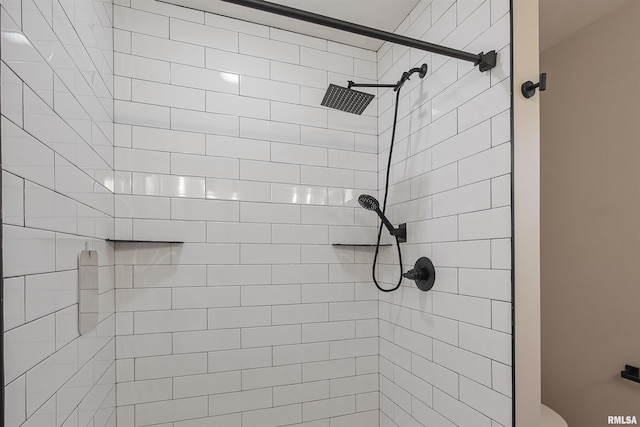 full bathroom with a tile shower