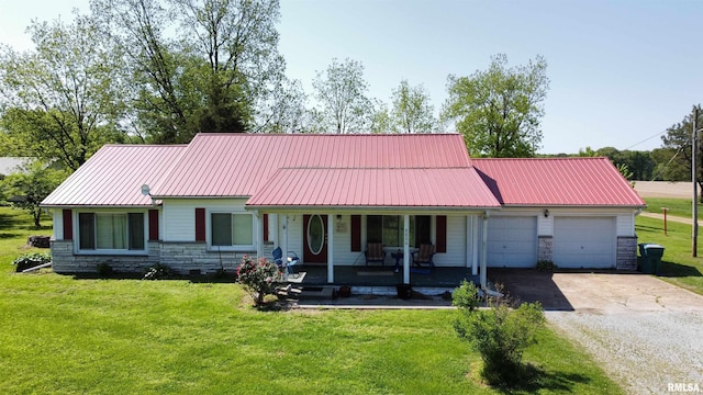 8806 Unionville Rd, Brookport, IL 62910 - view of front facade featuring an attached garage, a porch, a front lawn, and stone siding