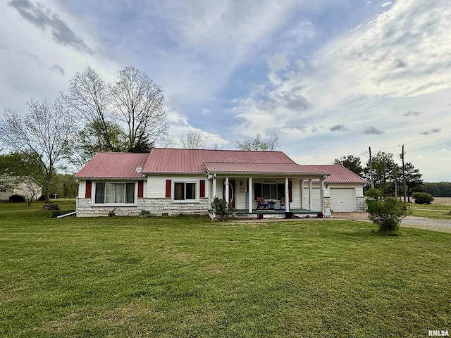 8806 Unionville Rd, Brookport, IL 62910 - view of front facade with a porch, driveway, metal roof, a front lawn, and stone siding