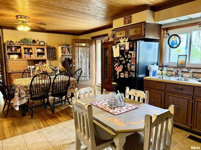 8806 Unionville Rd, Brookport, IL 62910 - dining area with crown molding, wood ceiling, ceiling fan, and light tile patterned floors
