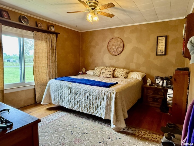 8806 Unionville Rd, Brookport, IL 62910 - bedroom with ornamental molding, a ceiling fan, and wood finished floors