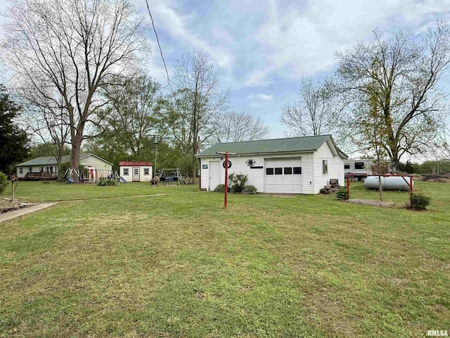 8806 Unionville Rd, Brookport, IL 62910 - view of yard featuring a detached garage and an outdoor structure