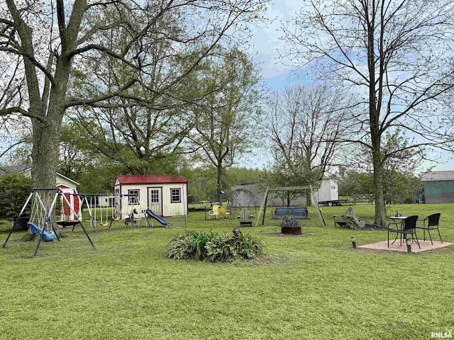8806 Unionville Rd, Brookport, IL 62910 - view of yard with an outbuilding, a playground, and a storage shed