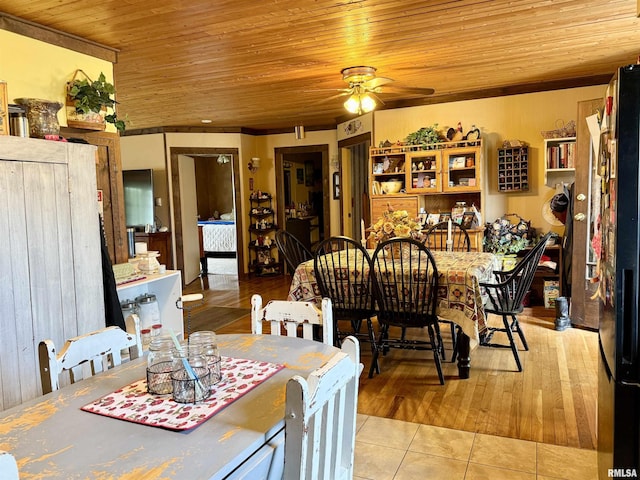 8806 Unionville Rd, Brookport, IL 62910 - dining area featuring ceiling fan, light tile patterned flooring, and wooden ceiling