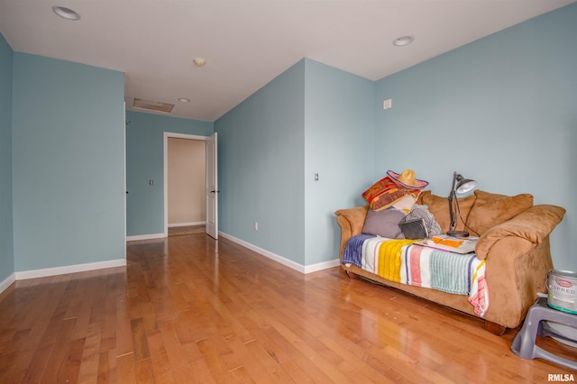 bedroom with baseboards, recessed lighting, and wood finished floors