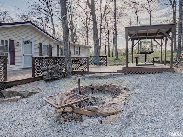 565 Dutton Chapel Rd, Golconda, IL 62938 - view of patio / terrace featuring a gazebo, a deck, and an outdoor fire pit