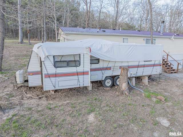565 Dutton Chapel Rd, Golconda, IL 62938 - rear view of property with metal roof