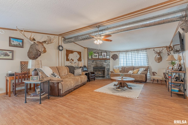 565 Dutton Chapel Rd, Golconda, IL 62938 - living area featuring crown molding, wood finished floors, a textured ceiling, and a fireplace
