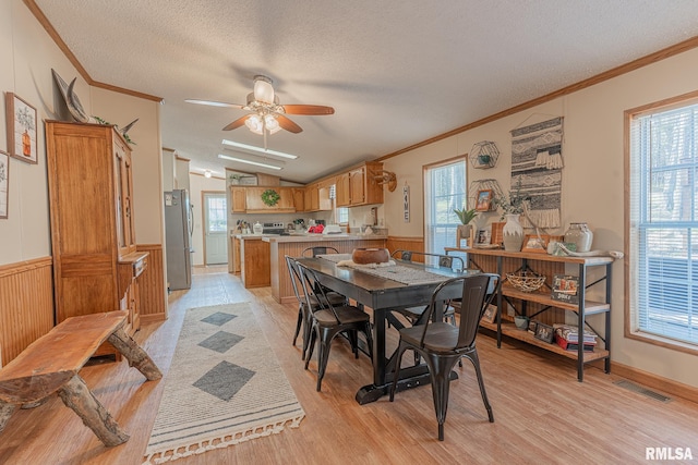 565 Dutton Chapel Rd, Golconda, IL 62938 - dining space with ceiling fan, a textured ceiling, light wood-type flooring, and ornamental molding
