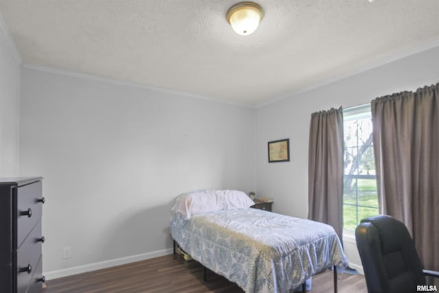 102 E Woolcott St, Harrisburg, IL 62946 - bedroom featuring baseboards, wood finished floors, and ornamental molding