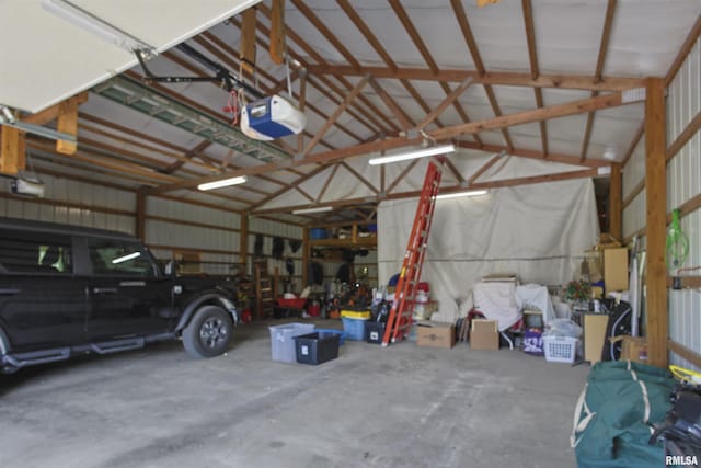 102 E Woolcott St, Harrisburg, IL 62946 - garage featuring a garage door opener and metal wall