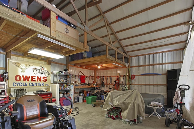 102 E Woolcott St, Harrisburg, IL 62946 - garage with metal wall and a workshop area