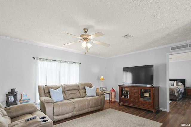 102 E Woolcott St, Harrisburg, IL 62946 - living room featuring visible vents, dark wood-style floors, a textured ceiling, and ceiling fan