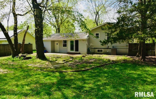 1001 S Emerald Ln, Carbondale, IL 62901 - rear view of house with a patio area, a lawn, and fence