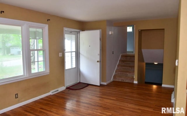 1001 S Emerald Ln, Carbondale, IL 62901 - foyer entrance with a wealth of natural light, wood finished floors, visible vents, and baseboards