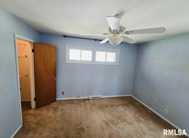 1001 S Emerald Ln, Carbondale, IL 62901 - empty room with baseboards, a ceiling fan, visible vents, and carpet flooring