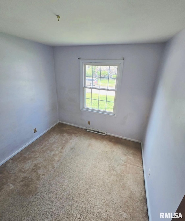 1001 S Emerald Ln, Carbondale, IL 62901 - carpeted empty room featuring baseboards and visible vents