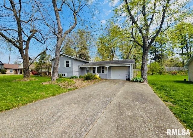 1001 S Emerald Ln, Carbondale, IL 62901 - tri-level home featuring driveway, a front yard, and a garage