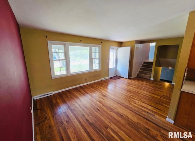 1001 S Emerald Ln, Carbondale, IL 62901 - empty room with stairway, plenty of natural light, visible vents, and wood finished floors