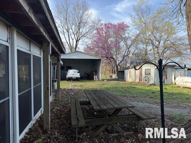 view of yard featuring a carport