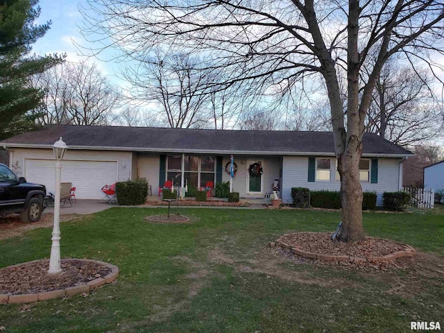 ranch-style house with a garage, a front yard, and concrete driveway