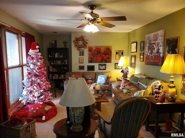 living room with light carpet, a ceiling fan, and recessed lighting