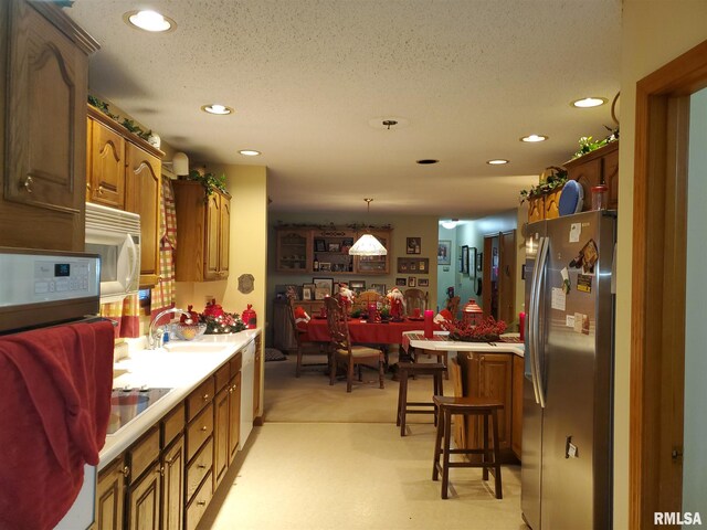 dining room with light carpet and a chandelier