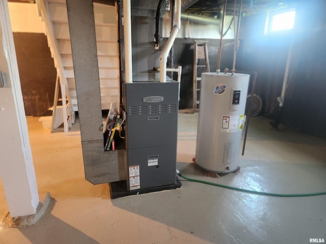 utility room featuring water heater