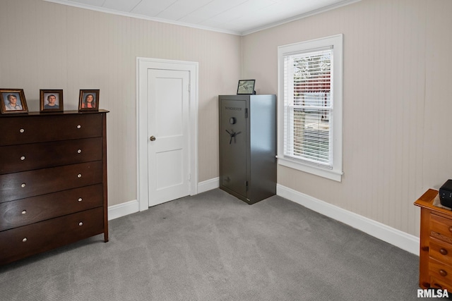 carpeted bedroom with baseboards and ornamental molding
