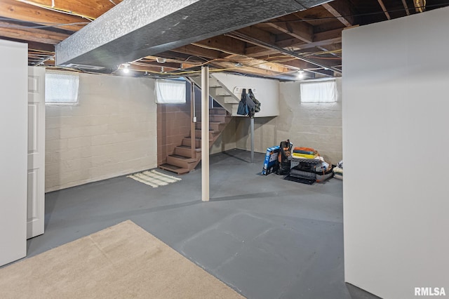 below grade area with stairway and a wealth of natural light