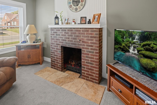 living room with a fireplace and carpet flooring