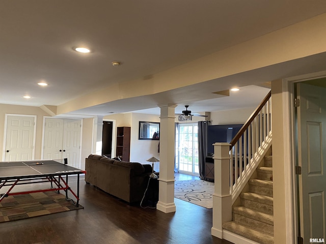 recreation room with recessed lighting, a ceiling fan, dark wood-type flooring, baseboards, and decorative columns