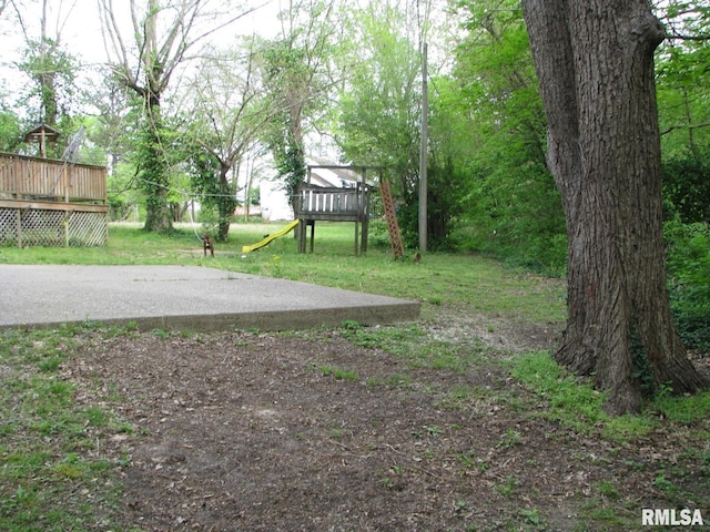 view of yard with a wooden deck