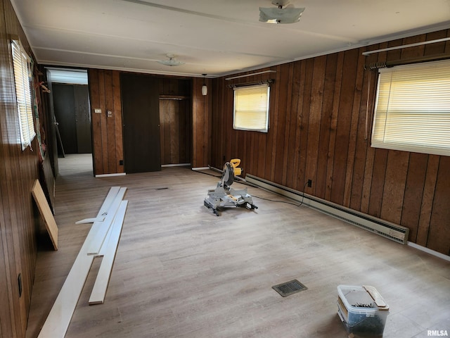 14625 E E Il Highway 15, Mount Vernon, IL 62864 - unfurnished room with wood walls, visible vents, and a baseboard heating unit