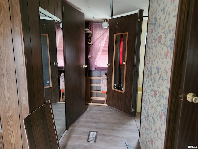 14625 E E Il Highway 15, Mount Vernon, IL 62864 - hallway featuring light wood-type flooring, visible vents, and wood walls