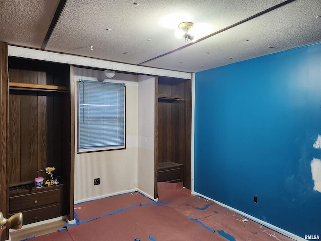 14625 E E Il Highway 15, Mount Vernon, IL 62864 - unfurnished bedroom with baseboards, a textured ceiling, and a closet