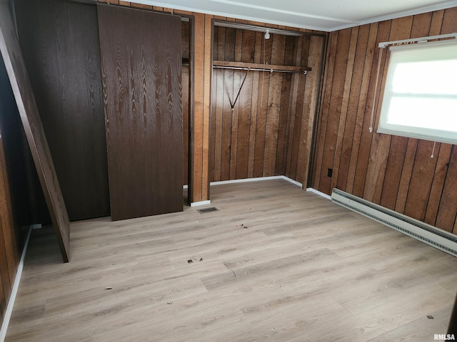 14625 E E Il Highway 15, Mount Vernon, IL 62864 - unfurnished bedroom featuring light wood finished floors, wooden walls, and visible vents