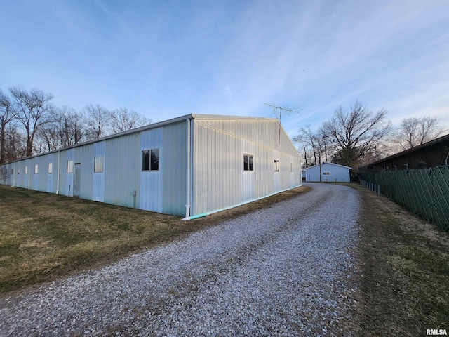 14625 E E Il Highway 15, Mount Vernon, IL 62864 - view of side of home featuring an outdoor structure, driveway, and fence