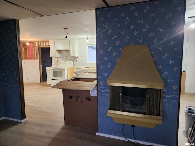 14625 E E Il Highway 15, Mount Vernon, IL 62864 - kitchen featuring white cabinets, wood finished floors, white electric stove, and wallpapered walls