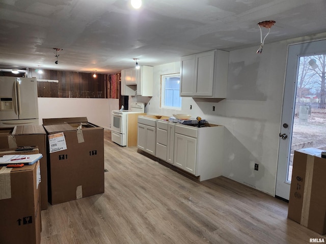 14625 E E Il Highway 15, Mount Vernon, IL 62864 - kitchen featuring a healthy amount of sunlight, light wood-style floors, and white appliances