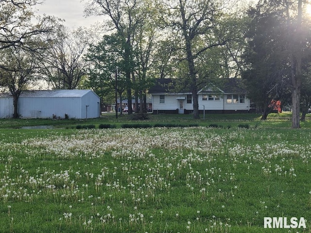 view of yard featuring an outbuilding and a pole building
