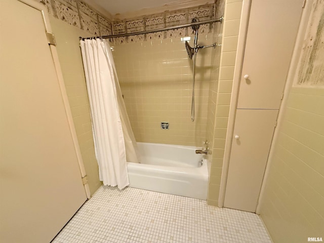 full bath with shower / bath combination with curtain and tile patterned flooring