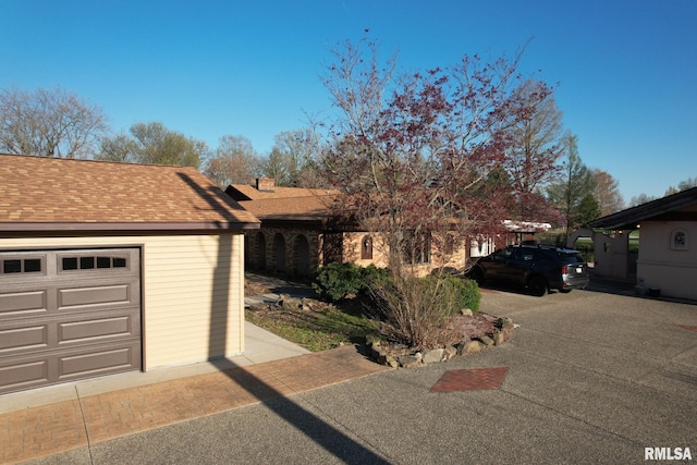 view of front facade with a garage and an outdoor structure
