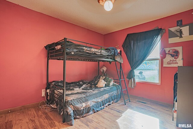 bedroom featuring wood finished floors