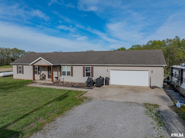 ranch-style home with a garage, a porch, a front lawn, and driveway