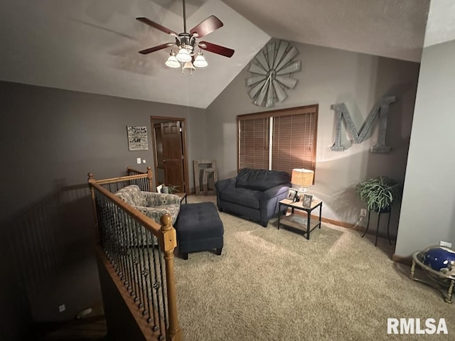living room with baseboards, ceiling fan, carpet, and vaulted ceiling