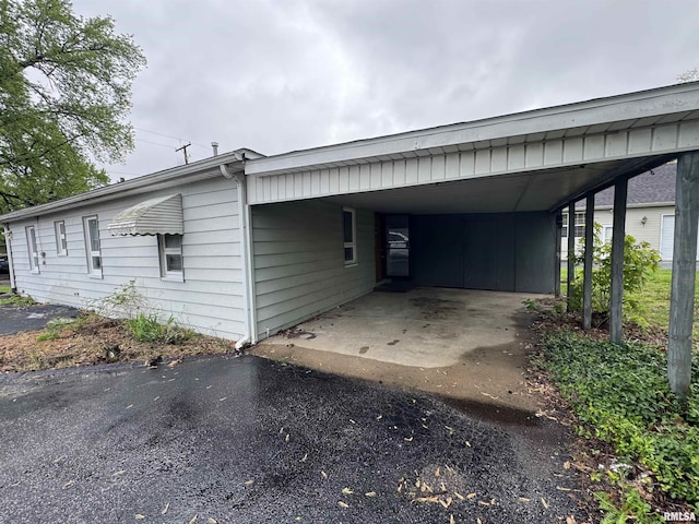 exterior space featuring an attached carport