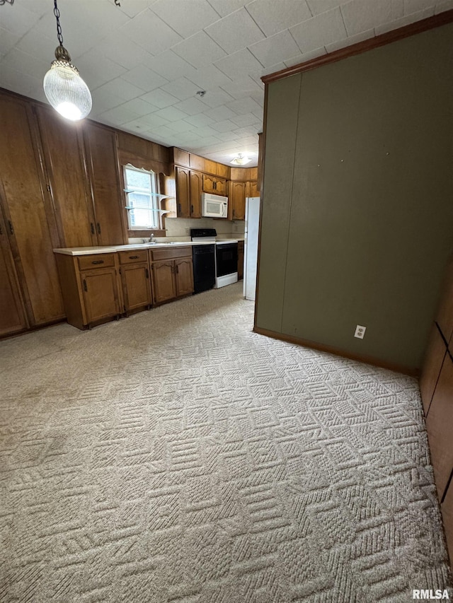 kitchen featuring light carpet, white appliances, light countertops, and brown cabinets