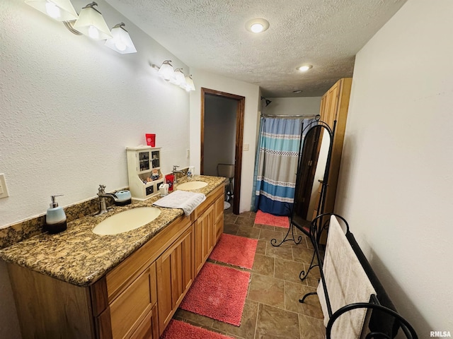 501 N Marion St, Salem, IL 62881 - full bathroom with a textured ceiling, a shower with curtain, double vanity, and a sink